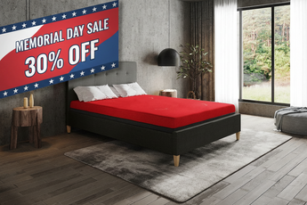 Thevo mattress on a bed with a Memorial Day sale banner in the corner of a room.