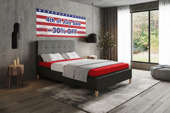 Bedroom with a bed and '4th of July Sale' banner on the wall.