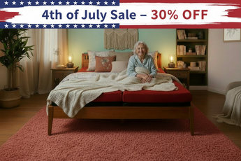Woman sitting on a bed with a '4th of July Sale - 30% OFF' banner above.