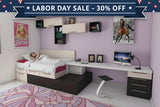 Modern bedroom with purple walls, a bed, desk, and various decor items.